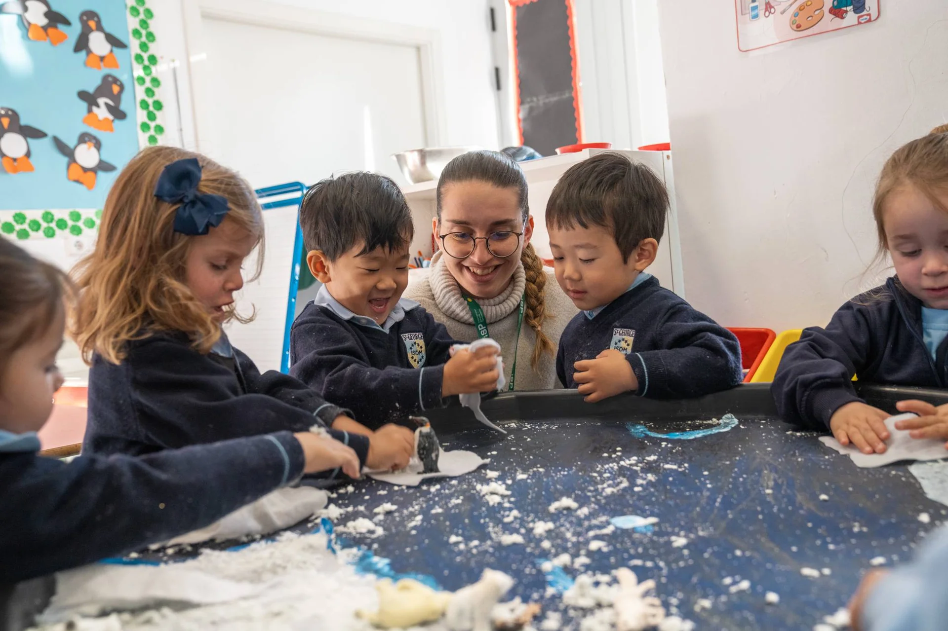 Teacher with two kids in the classroom
