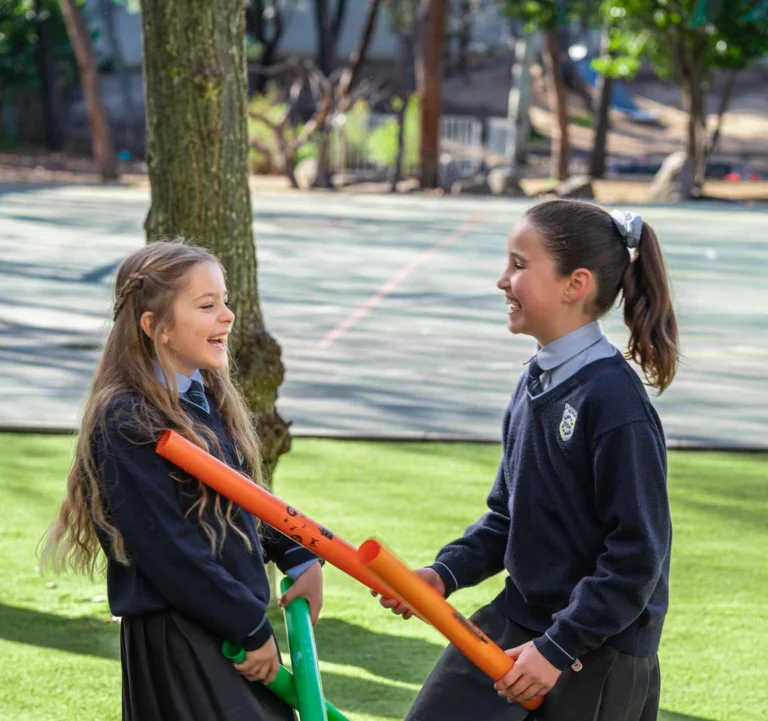 Two students playing with tubes