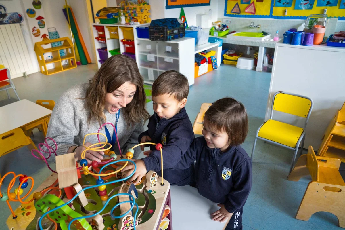 Teacher and students playing in the classroom