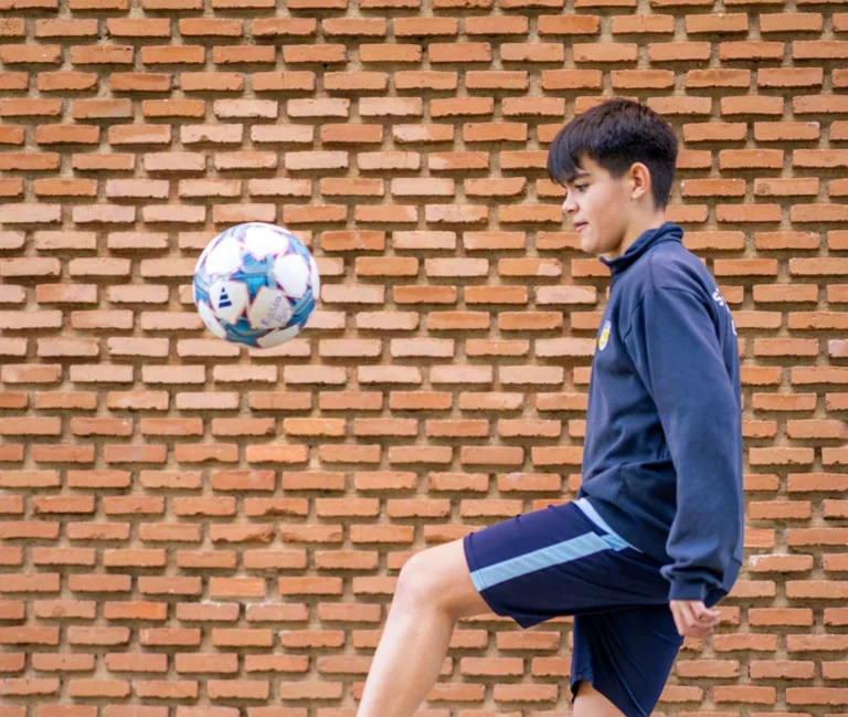 Student dribbles with the ball