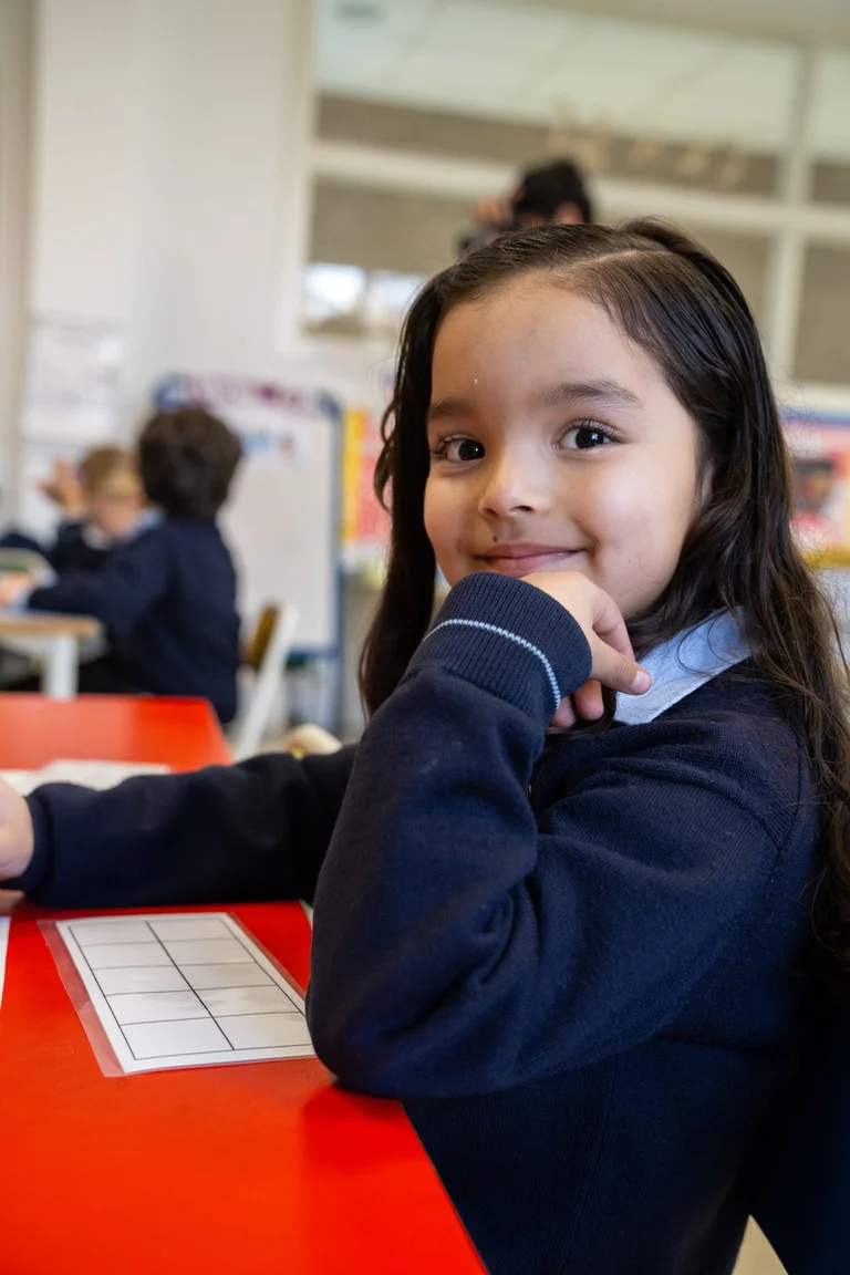 Child smiling in the classroom