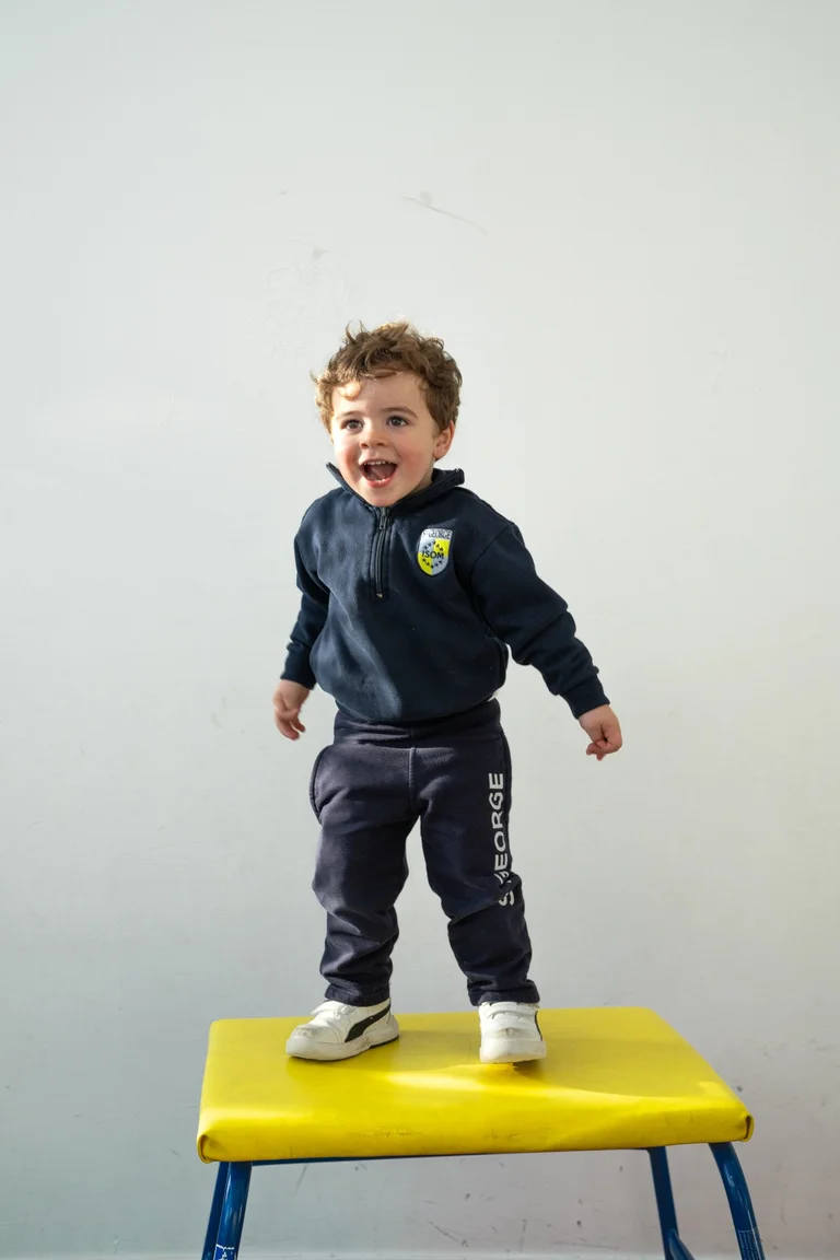 Child in uniform smiling