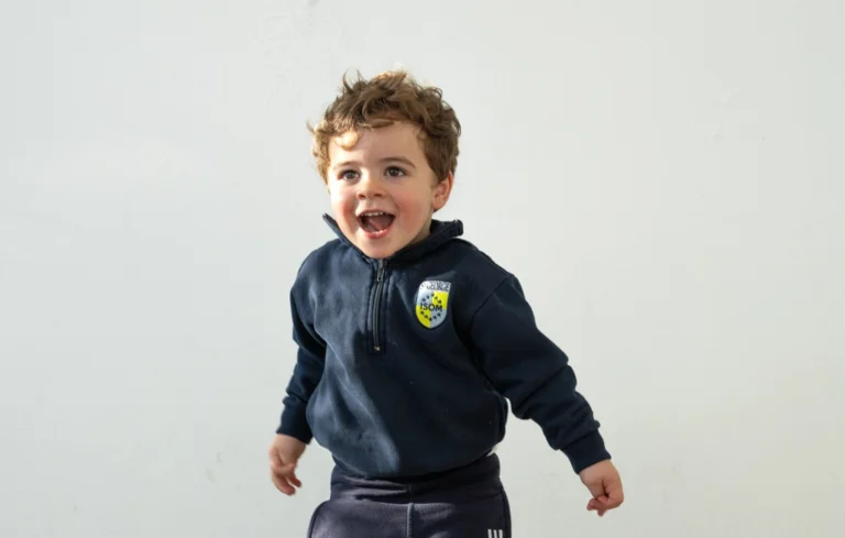 Child in uniform smiling