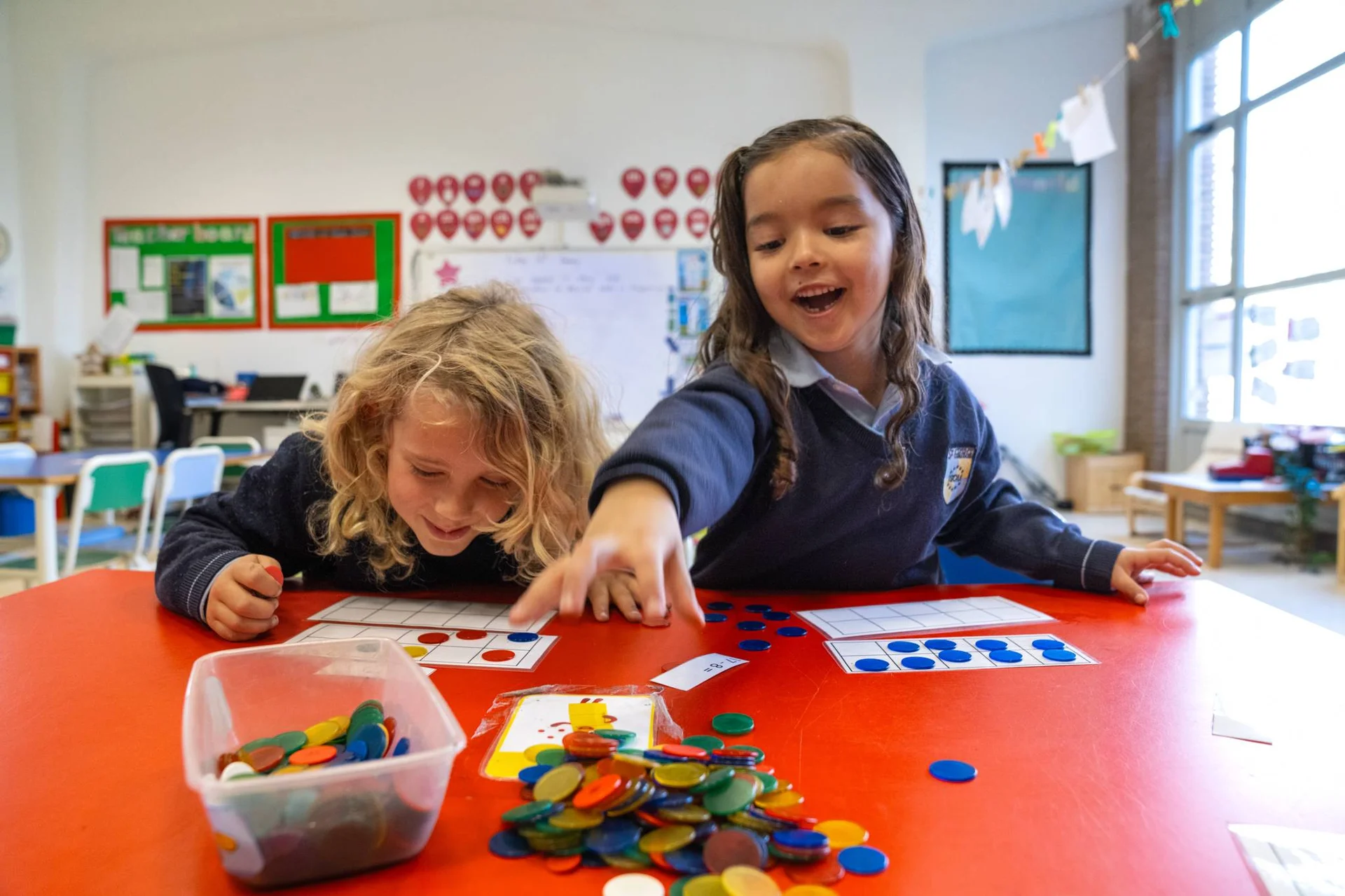 Two little students during maths class