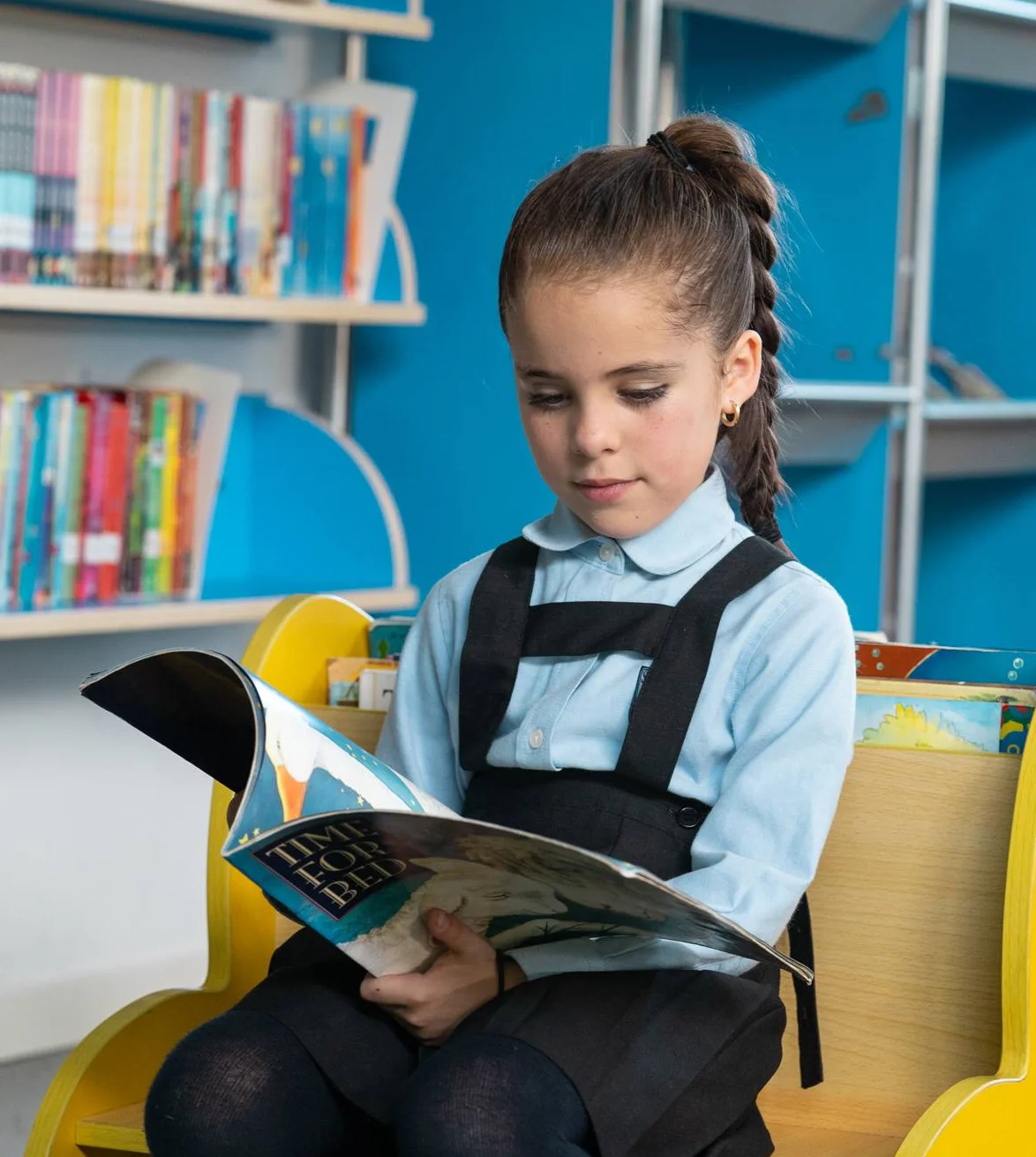 Little girl reading a book