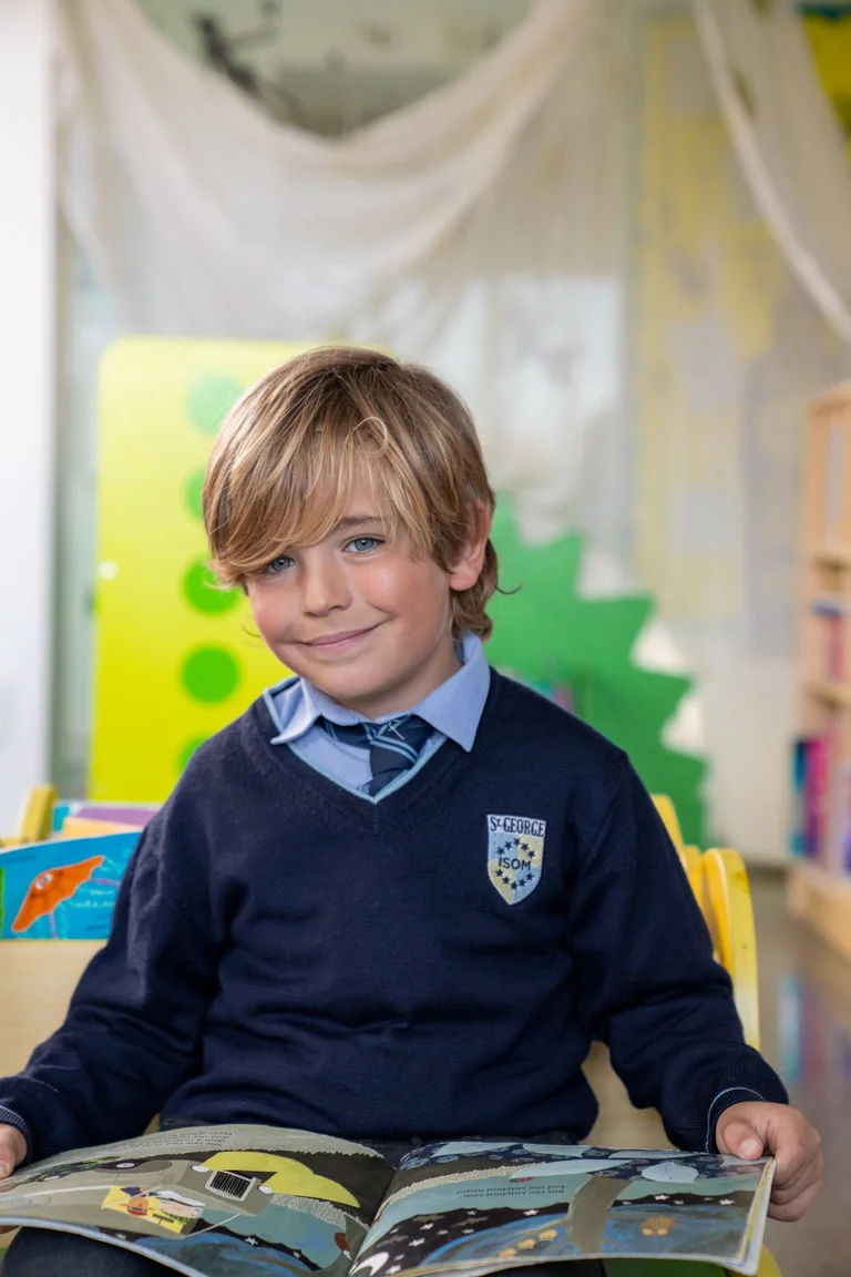 Student in uniform smiling
