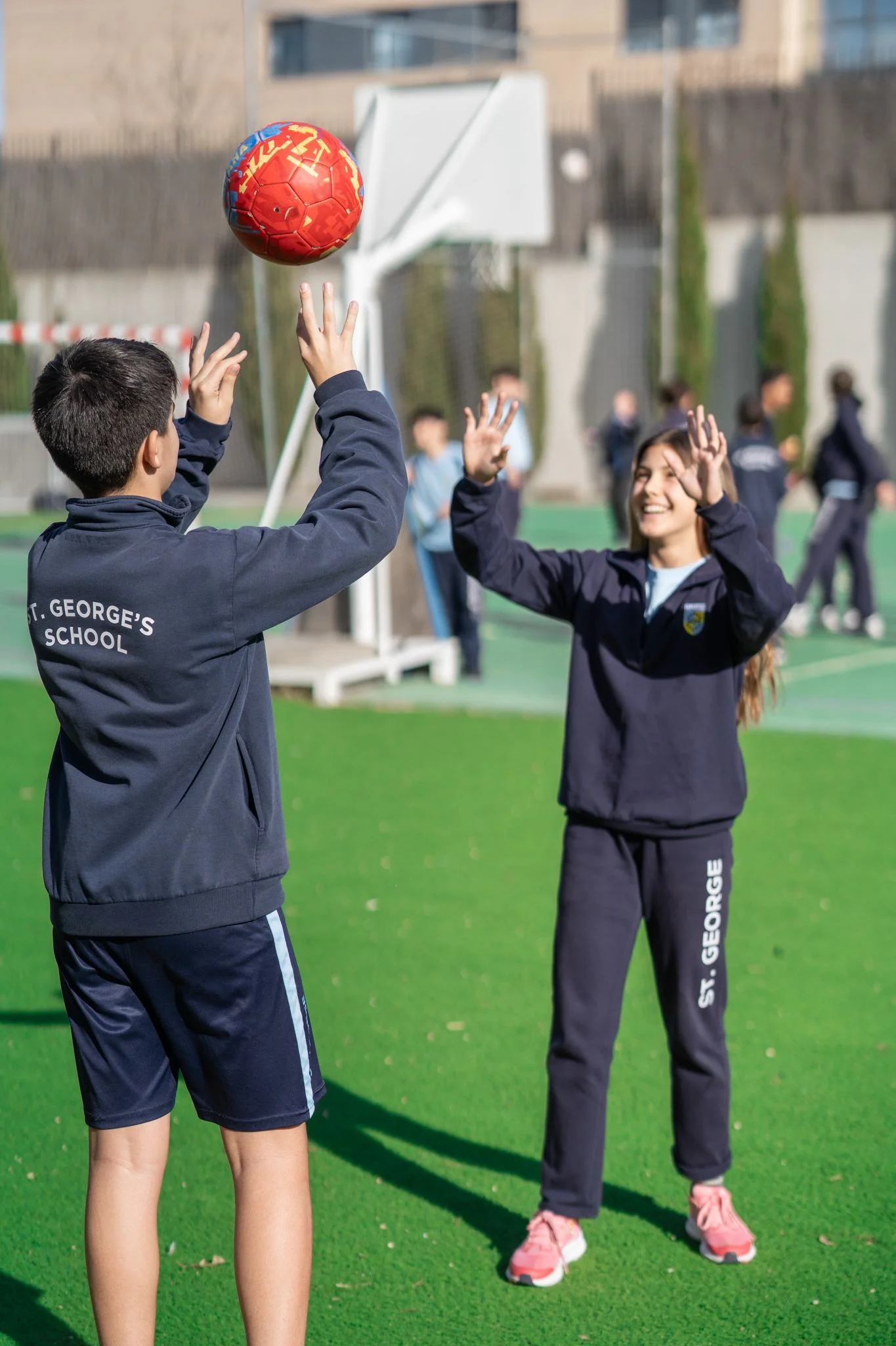 Students playing volleyball