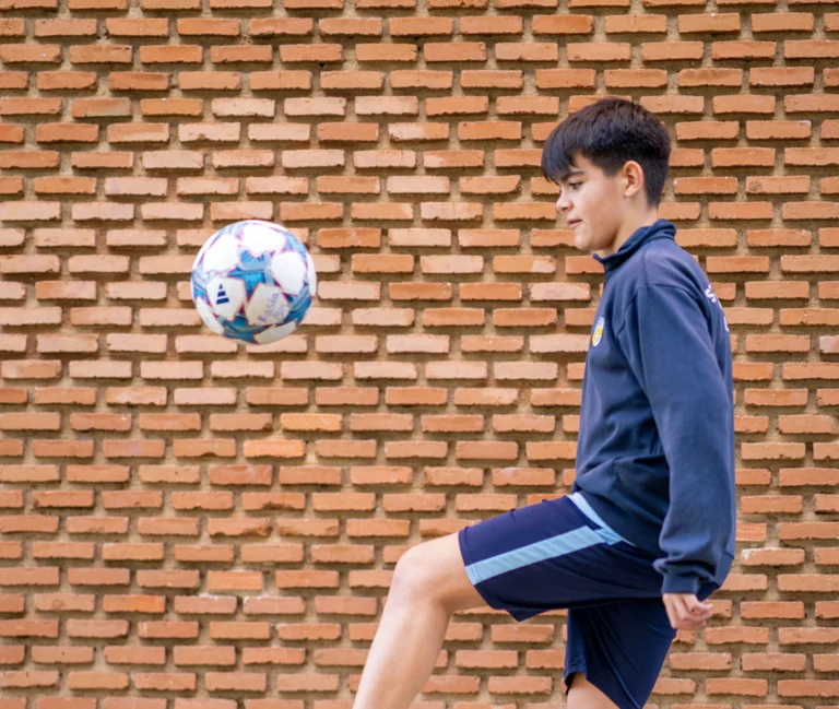 Student dribbles with the ball